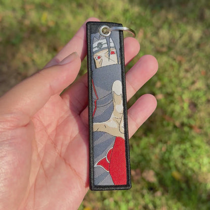 Shadow Of Sacrifice Embroidered Jet Tag Keychain