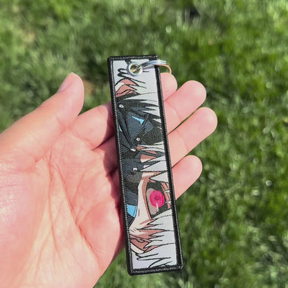 One Eyed Shadow Motion Sticker/Embroidered Keychain (Bundle)